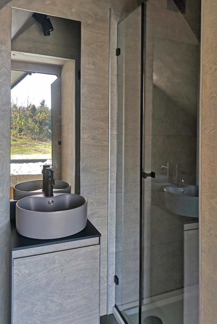 Spacious bathroom with composting toilets